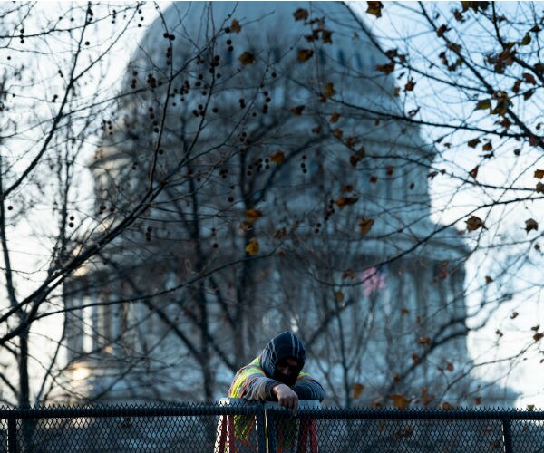 us capitol building being secured by a worker 