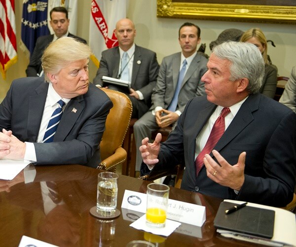 president donald trump listening to bob hugin in the white house