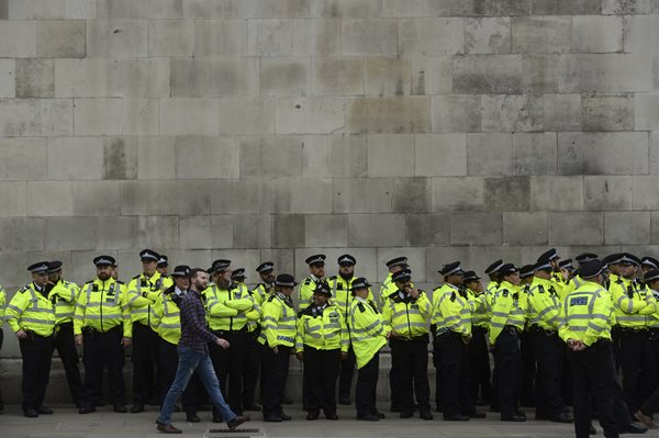 police officers are shown wearing safety vests