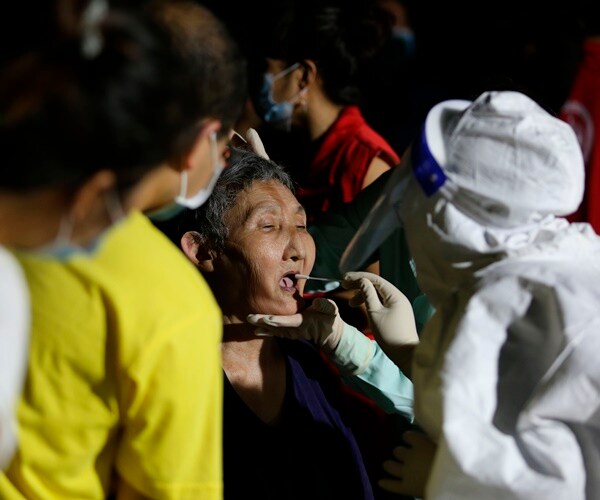 Chinese Cities Test Millions as Virus Cases Surge