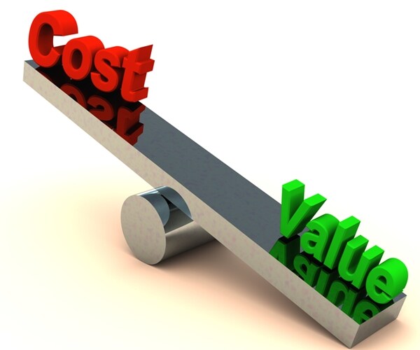 value outweighing cost on a chrome balance on white surface 