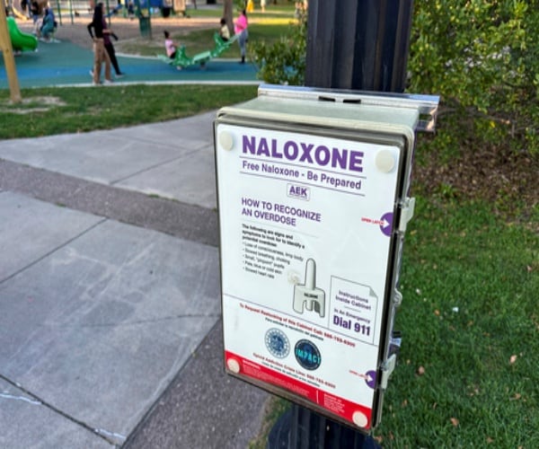 box of free naloxone in a park