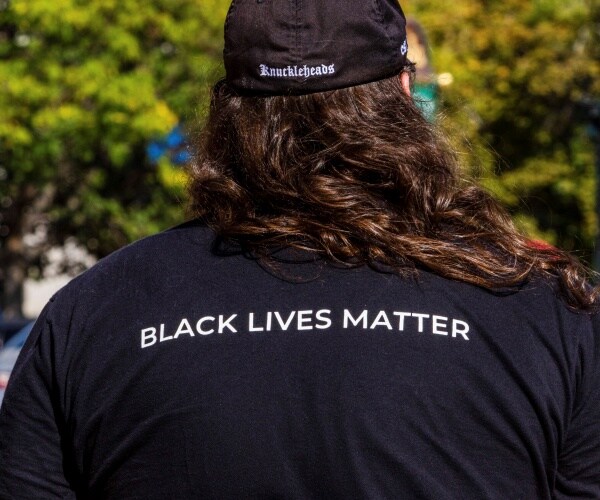 man wearing black lives matter tshirt