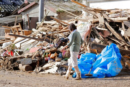 The Latest: Japan Says Death Toll from Floods Climbs to 100