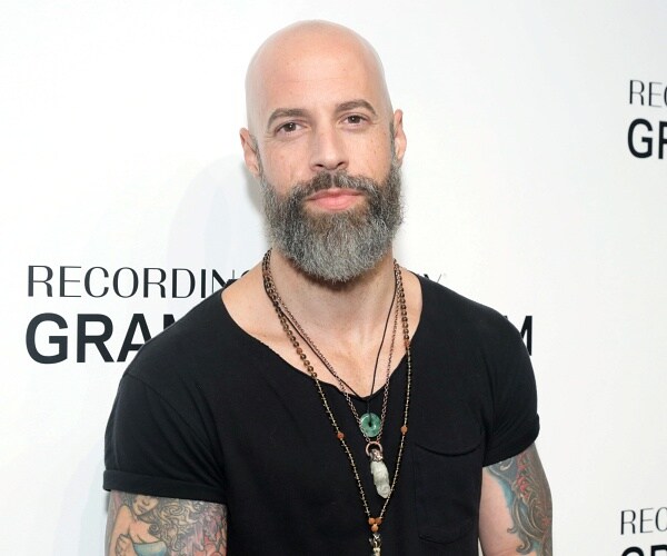 chris daughtry stands on red carpet