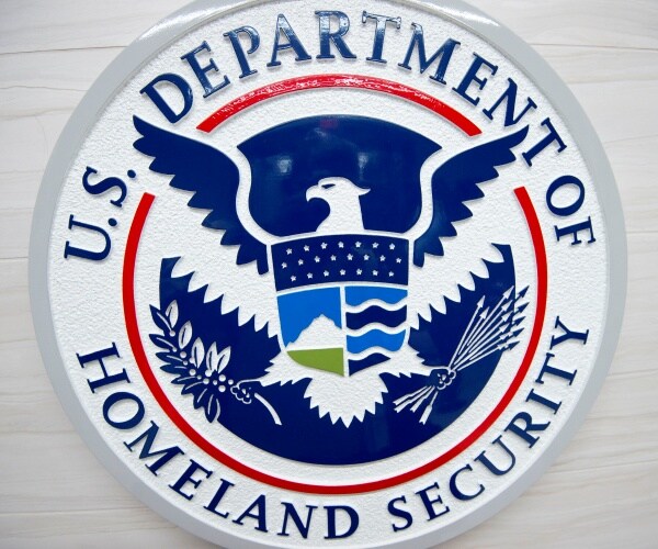 dhs logo in white and blue