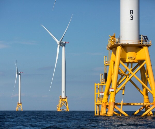 Three of Deepwater Wind's five turbines stand in the water