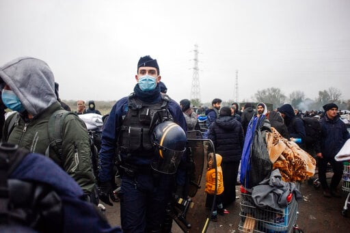 French Police Evacuate Migrants from Makeshift Camp