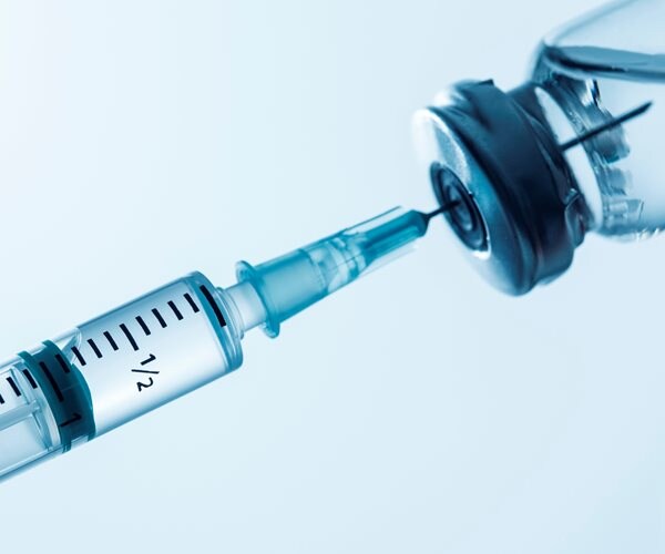 Syringe being filled