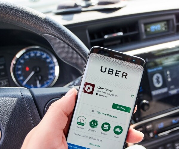 uber app is shown in the android store on a smartphone