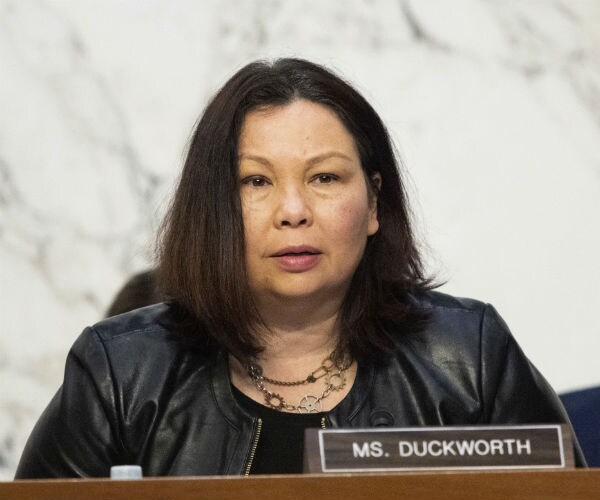 sen. tammy duckworth is seen at a senate committee hearing 