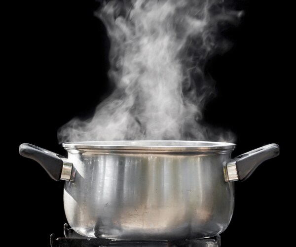 steam over a pot of water