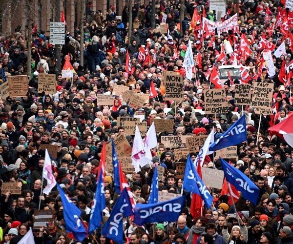 demonstrators march during a rally