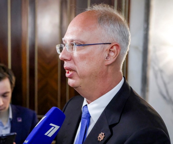 man speaks into microphone