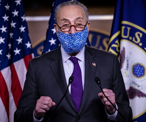 chuck schumer speaks from podium