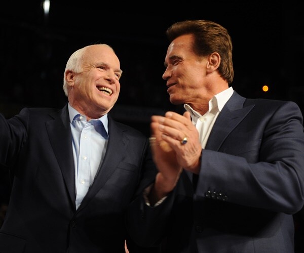 arnold schwarzenegger smiles and claps with then presidential candidate john mccain