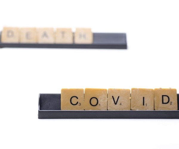 COVID DEATH written in scrabble letters