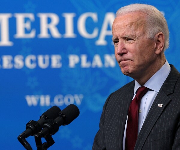 joe biden speaks into mic