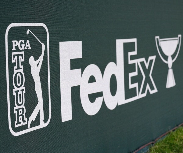 pga tour fedex cup signage with white on green background