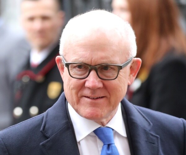 johnson in a suit and bright blue tie