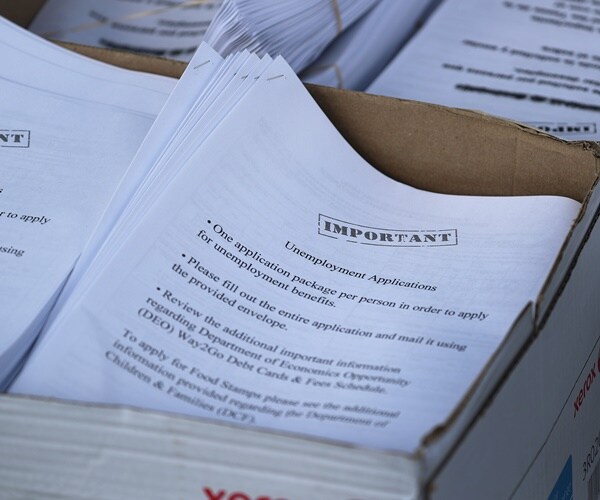 boxes of unemployment applications are handed out to floridians