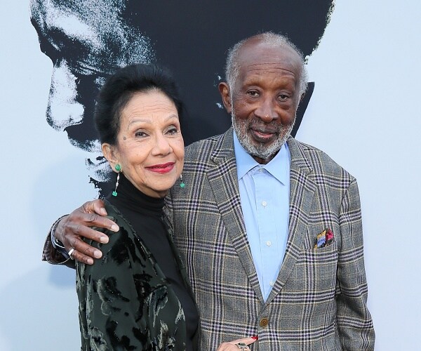 clarence and jacqueline avant stand on red carpet