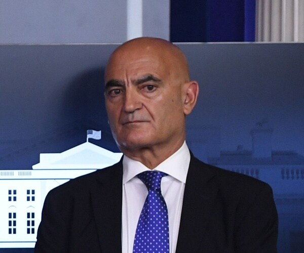 moncef slaoui stands to side at press briefing