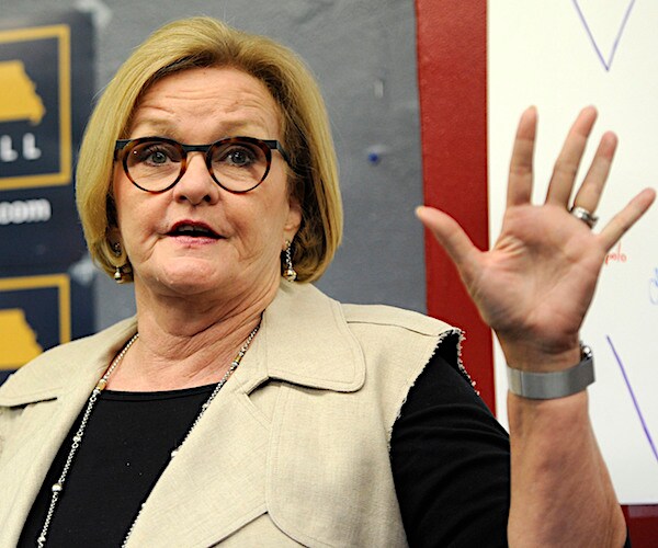 missouri democratic senator claire mccaskill raises his left hand to display five fingers during an interview