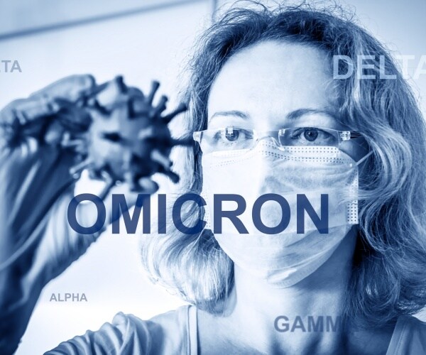 scientist in goggles analyzing omicron particles