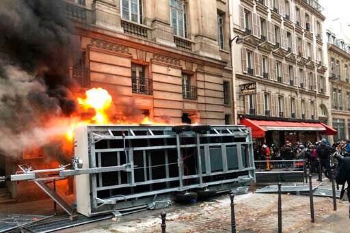 The Latest: French Protesters Set Fires amid Strikes