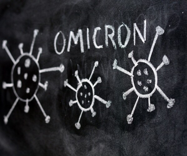 The word omicron written on a blackboard