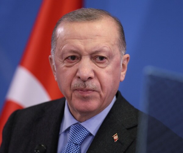 Tayyip Erdogan addresses media representatives during a press conference