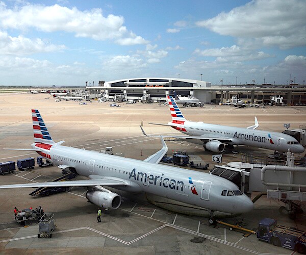 planes sit idle at an airport terminal
