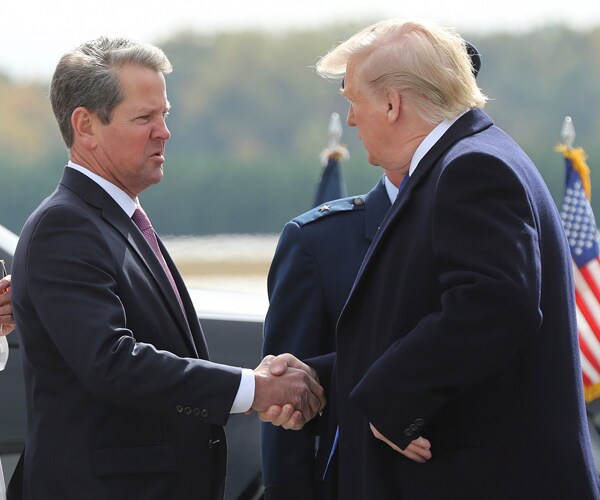 Georgia Gov. Brian Kemp greets President Donald Trump