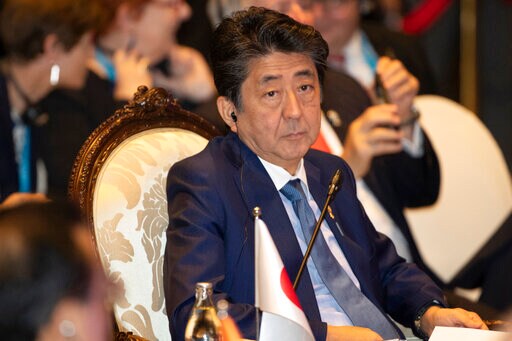 Moon, Abe Meet Briefly, Agree to More Talks to Settle Row