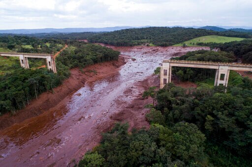 The Latest: Brazil Family Digs for Relative Buried in Mud