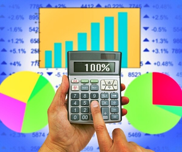 close up of businessman using the calculator to know the result of earnings.