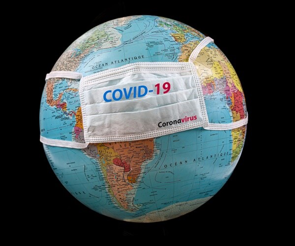 a globe with a covid-19 mask