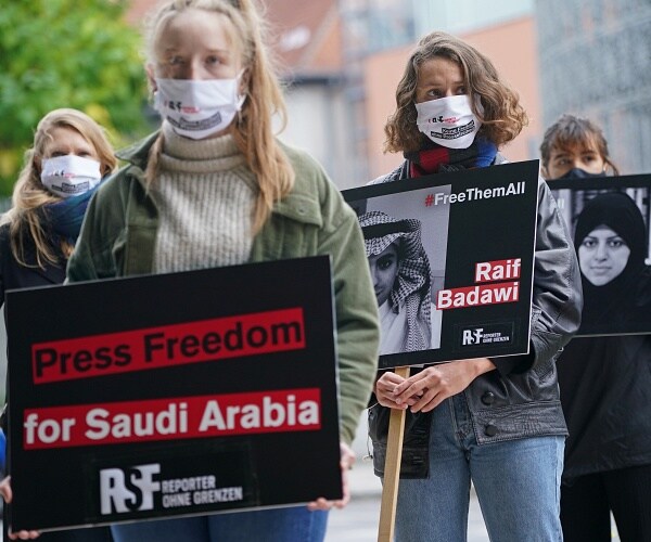 protesters holding signs