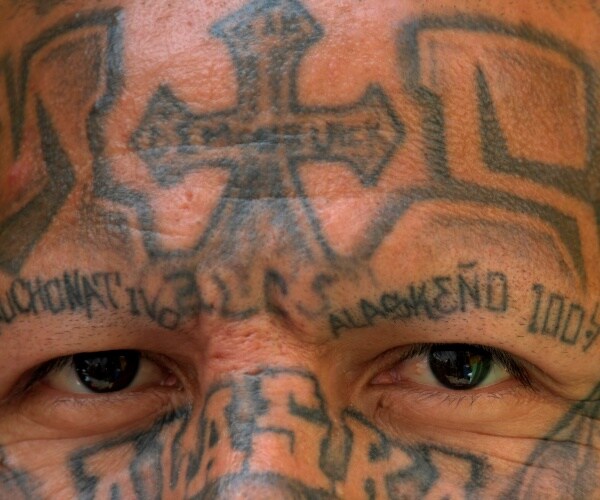 a man with face tattos