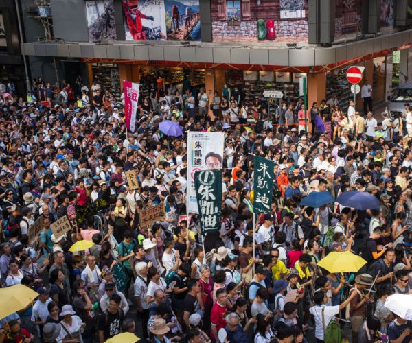 Tens of Thousands Protest in Hong Kong over Jailing of Democracy Activists