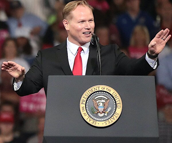 steve watkins speaks during a rally with president donald trump