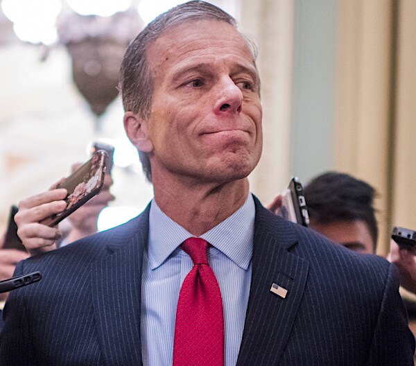 john thune grits his teeth during a media scrum