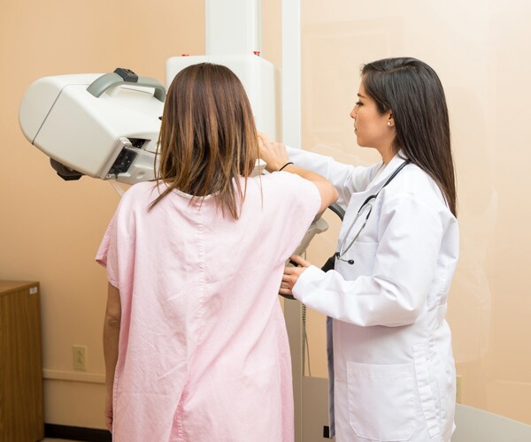 a woman undergoing a mammogram test