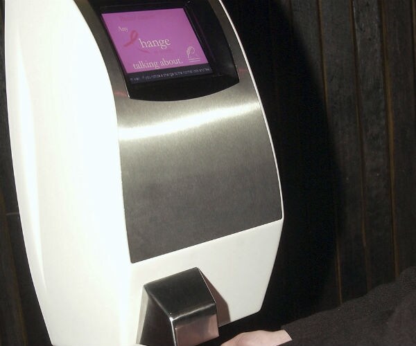 a person is shown using an air hand dryer