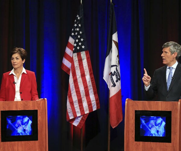iowa gov. kim reynolds and democratic candidate fred hubbell participate in a debate
