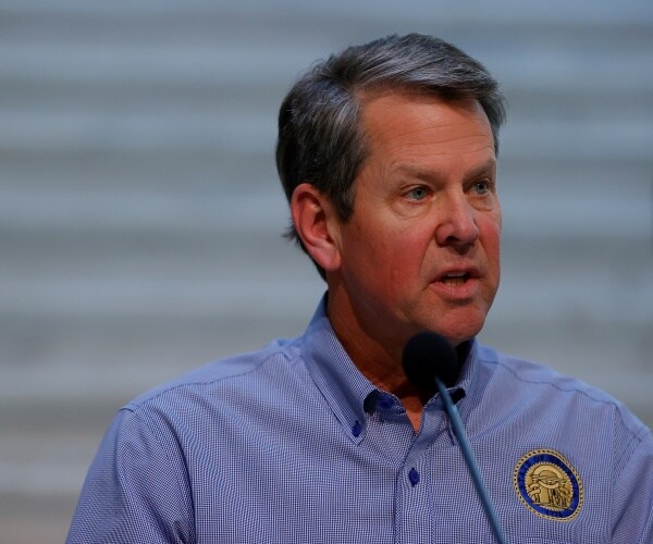 kemp in a blue shirt