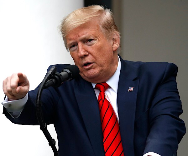 president donald trump points at another reporter to ask a question