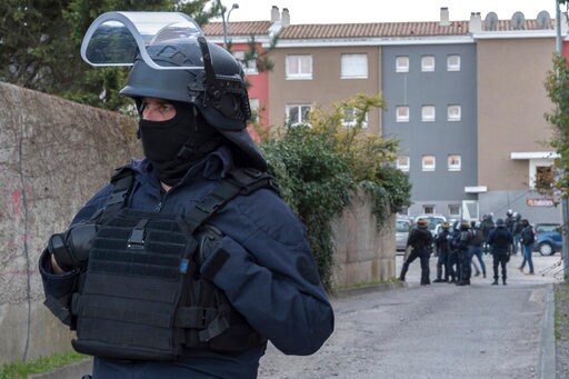 The Latest: French Officer Mom Not Surprised by His Courage