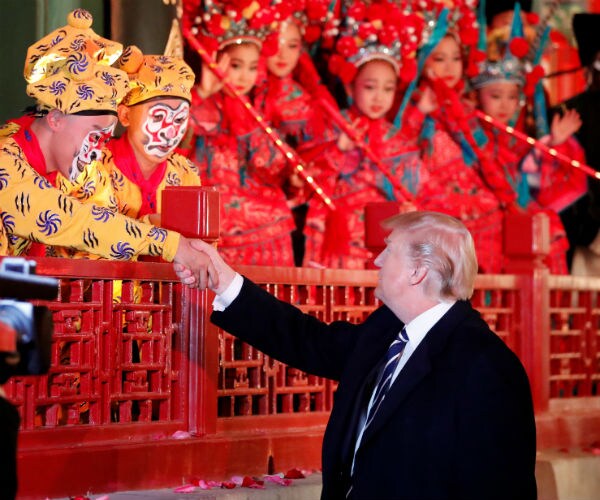 Soldiers, Jumping Children Greet Trump at Beijing Airport
